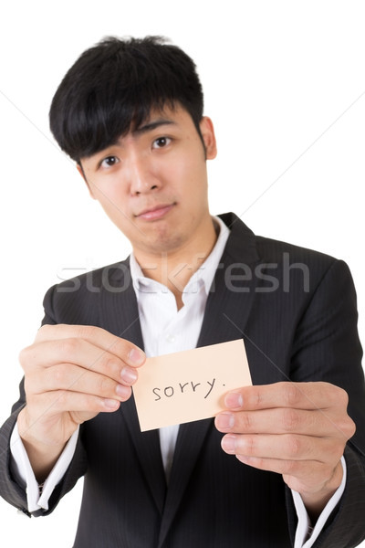 Siralmas szó ázsiai üzletember tart kártya Stock fotó © elwynn
