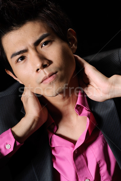 Przystojny asian biznesmen portret ciemne Zdjęcia stock © elwynn
