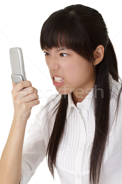 Mérges üzletasszony bámul mobiltelefon nő iroda Stock fotó © elwynn