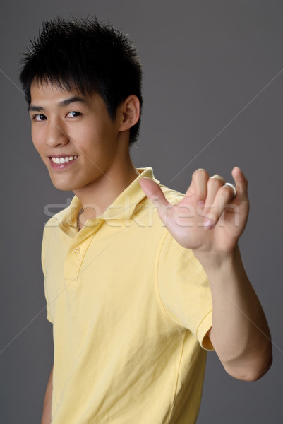 Smiling young man Stock photo © elwynn