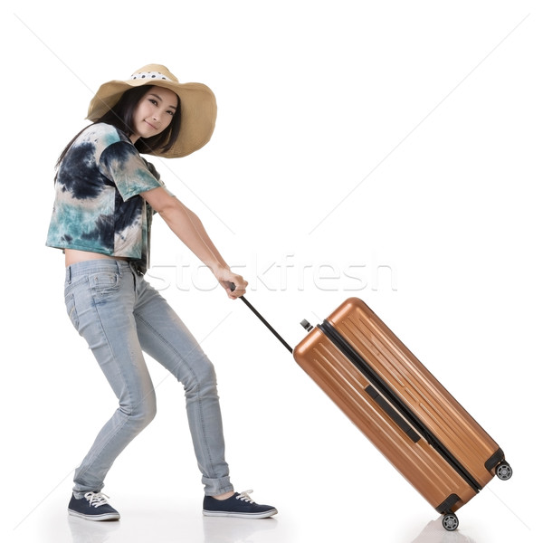 woman drag a luggage Stock photo © elwynn