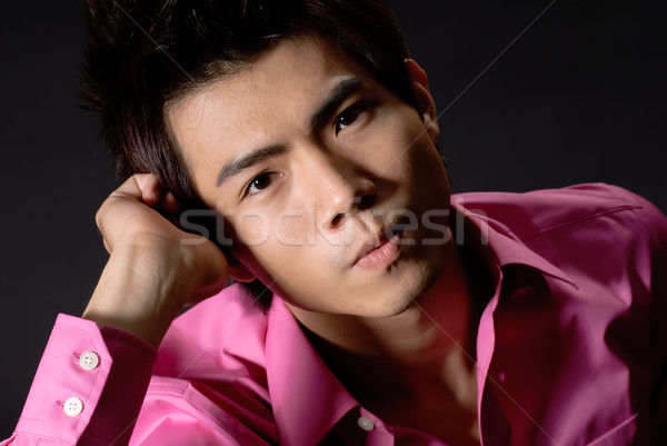 Pondering young business man Stock photo © elwynn