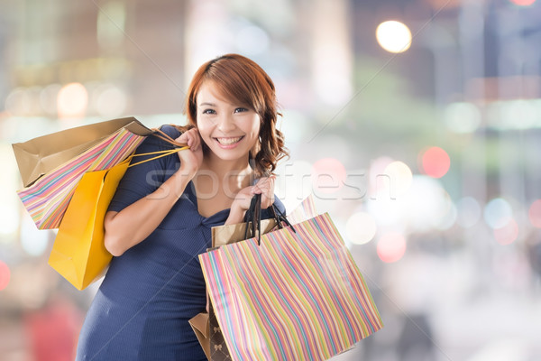 Cheerful shopping woman Stock photo © elwynn