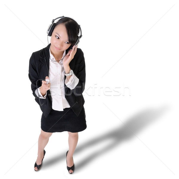 Young business woman listening music Stock photo © elwynn