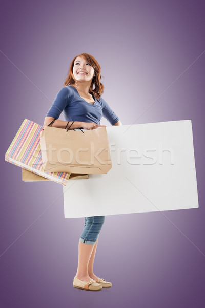 Shopping woman holding bags and blank board Stock photo © elwynn