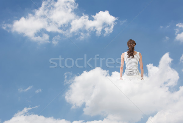 Brunet woman sit on clouds Stock photo © elwynn
