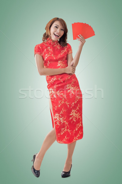 Chinese woman dress cheongsam and hold red envelope Stock photo © elwynn