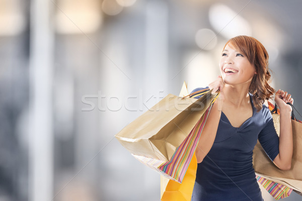 Cheerful shopping woman Stock photo © elwynn