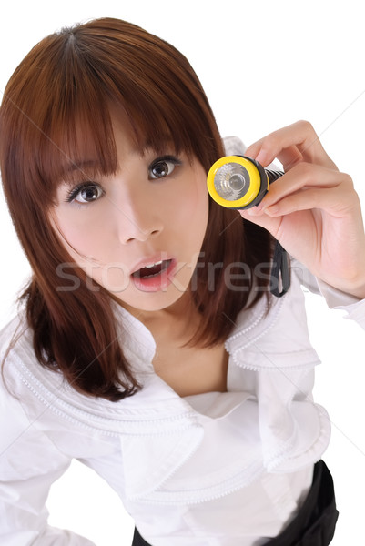 Young business woman using torch Stock photo © elwynn