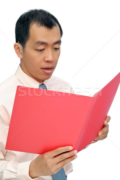 Сток-фото: удивленный · деловой · человек · чтение · бумаги · красный · папке