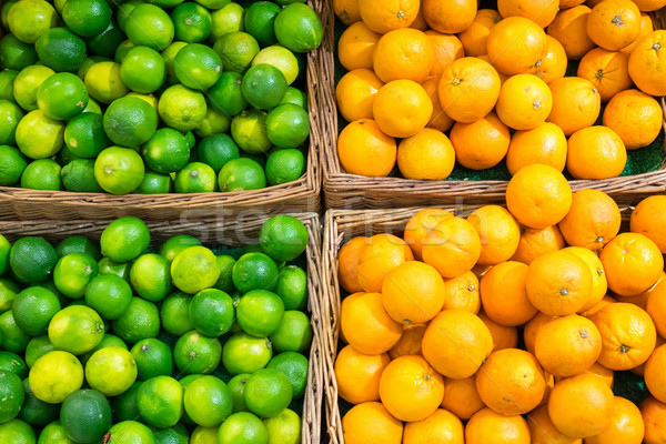 Limes and oranges Stock photo © elxeneize