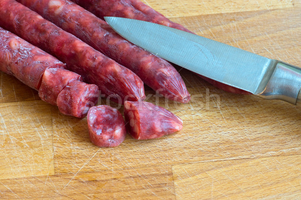 Salami with a knife Stock photo © elxeneize