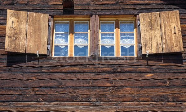 Two windows of a wooden hut Stock photo © elxeneize