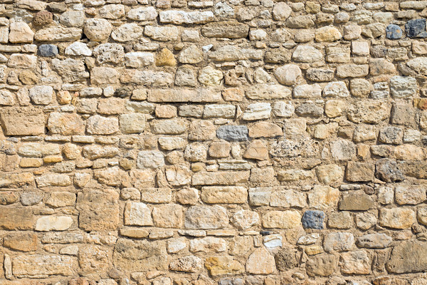 Antique natural stonewall Stock photo © elxeneize