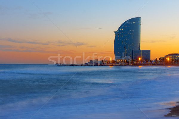 Arranha-céu praia pôr do sol Barcelona paisagem verão Foto stock © elxeneize