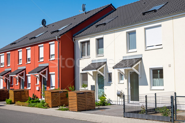 Red and white serial houses Stock photo © elxeneize