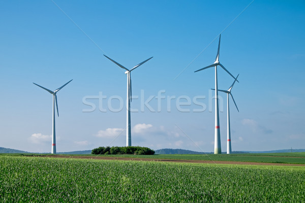 Windwheels under a blue sky Stock photo © elxeneize