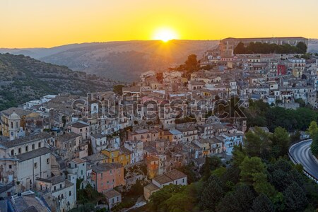 Sunrise in Ragusa Ibla in Sicily Stock photo © elxeneize