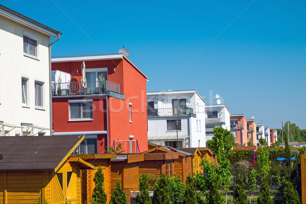 Serial houses with gardens Stock photo © elxeneize