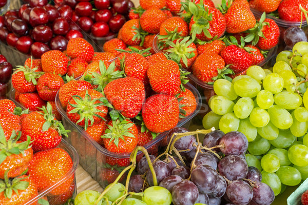 Strawberries, cherries and grapes Stock photo © elxeneize