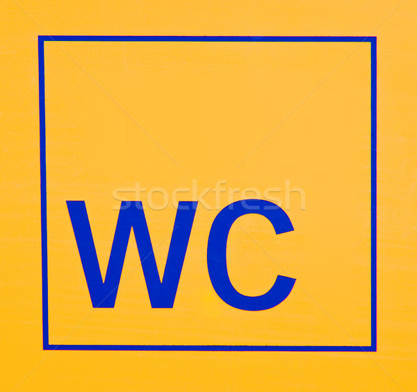 Wc segno bagno blu lettere giallo Foto d'archivio © elxeneize