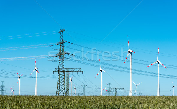 Wind energy and power transmission lines in Germany Stock photo © elxeneize