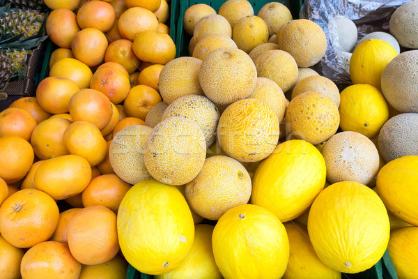 Melons and clementines Stock photo © elxeneize