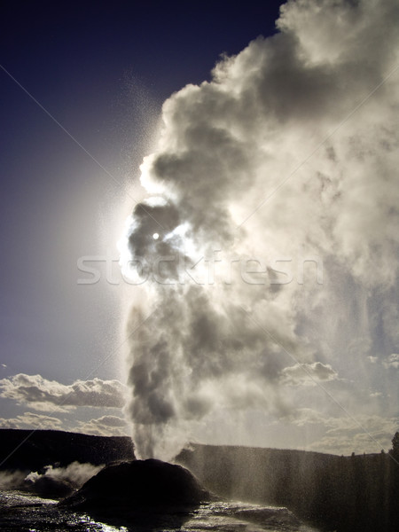 Lion Geyser erupts and blots out the sun Stock photo © emattil
