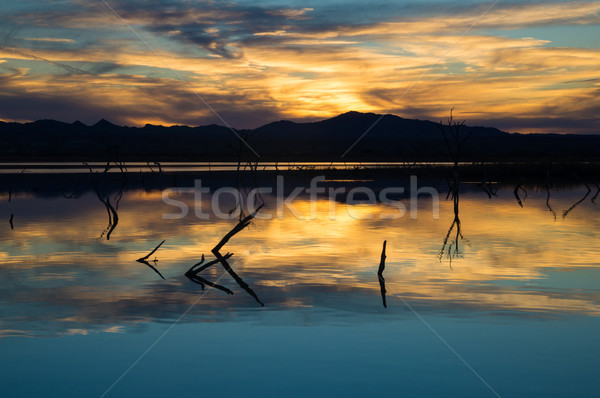 Este izzik tó víz naplemente felhők Stock fotó © emattil