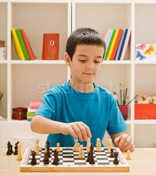 Boy playing chess Stock photo © emese73