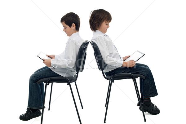 Modernes deux heureux garçons livre électronique lecteur [[stock_photo]] © emese73