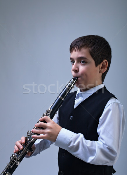Boy playing on the clarinet Stock photo © emese73
