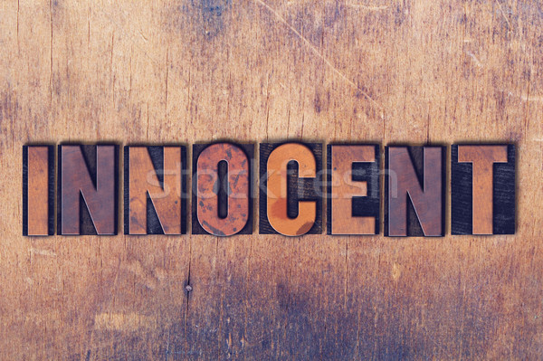 Innocent Theme Letterpress Word on Wood Background Stock photo © enterlinedesign
