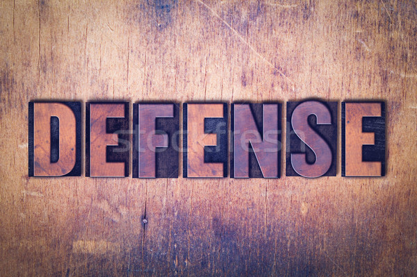 Defense Theme Letterpress Word on Wood Background Stock photo © enterlinedesign