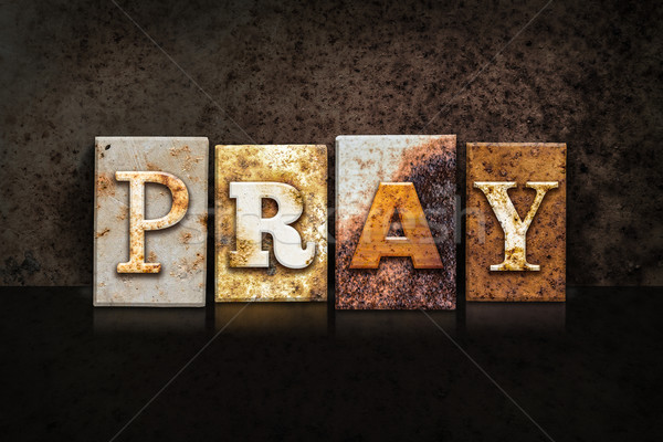 Pray Letterpress Concept on Dark Background Stock photo © enterlinedesign