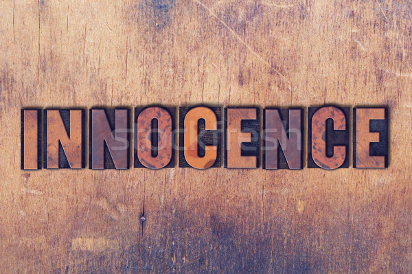 Innocence Theme Letterpress Word on Wood Background Stock photo © enterlinedesign