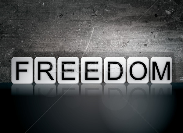 Freiheit gefliesten Briefe Wort geschrieben weiß Stock foto © enterlinedesign