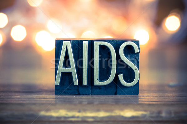 AIDS fém magasnyomás szó írott Stock fotó © enterlinedesign