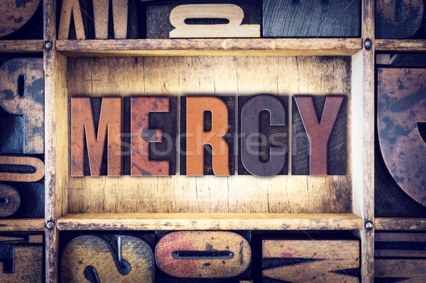 Mercy Concept Letterpress Type Stock photo © enterlinedesign