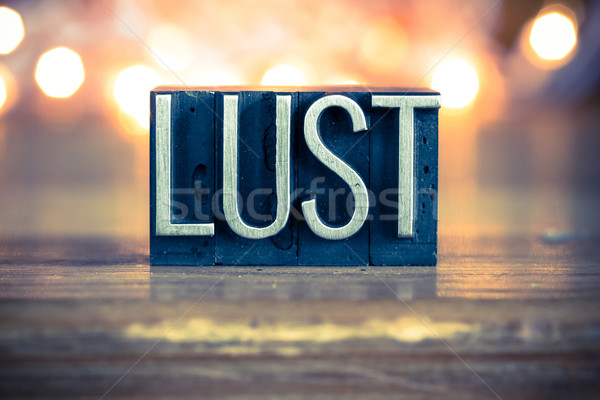 Lust Concept Metal Letterpress Type Stock photo © enterlinedesign