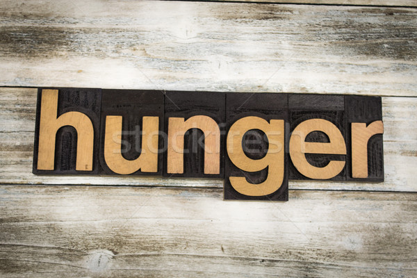 Stock photo: Hunger Letterpress Word on Wooden Background