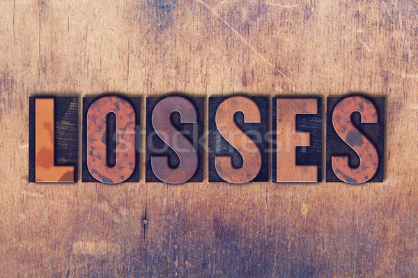 Losses Theme Letterpress Word on Wood Background Stock photo © enterlinedesign