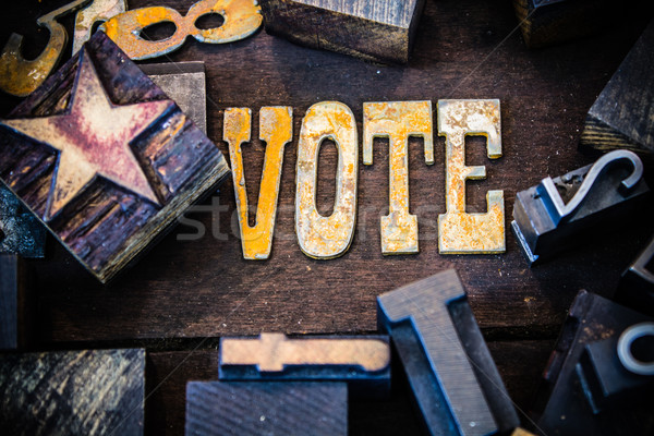 Vote Concept Wood and Rusted Metal Letters Stock photo © enterlinedesign