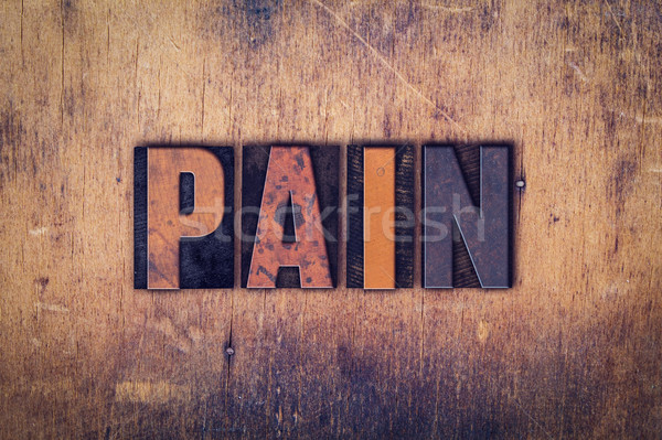 Pain Concept Wooden Letterpress Type Stock photo © enterlinedesign