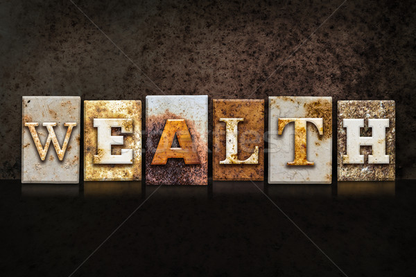 Wealth Letterpress Concept on Dark Background Stock photo © enterlinedesign
