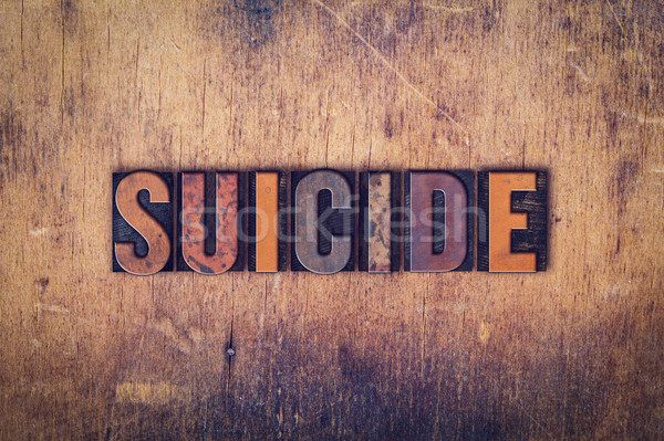 Suicidio legno tipo parola scritto Foto d'archivio © enterlinedesign