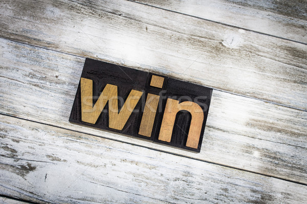 Win Letterpress Word on Wooden Background Stock photo © enterlinedesign