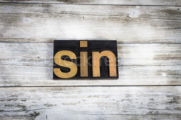 Sin Letterpress Word on Wooden Background Stock photo © enterlinedesign