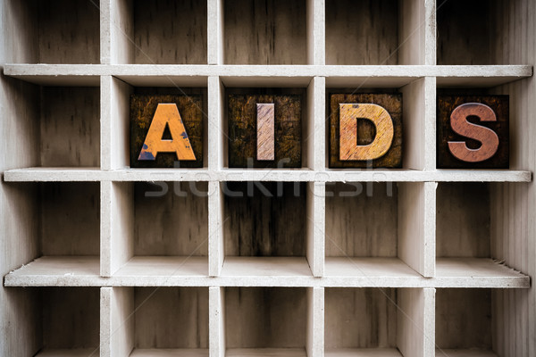 AIDS Concept Wooden Letterpress Type in Draw Stock photo © enterlinedesign