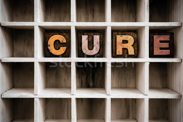 Cure Concept Wooden Letterpress Type in Draw Stock photo © enterlinedesign